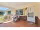 Inviting covered front porch with comfortable seating, perfect for enjoying the outdoors at 8625 Sw 94Th Ln # D, Ocala, FL 34481