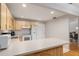 Functional kitchen featuring light wood cabinetry, white appliances, and ample counter space for meal preparation at 8625 Sw 94Th Ln # D, Ocala, FL 34481