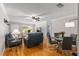 Open living space with hardwood floors, blue sofas, dining area, and natural light, perfect for modern living at 8625 Sw 94Th Ln # D, Ocala, FL 34481