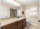 Bathroom features granite countertop, sleek vanity, and dark bronze fixtures at 8750 Sw 108Th St, Ocala, FL 34481