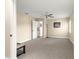 An open doorway reveals a spacious bedroom with a ceiling fan and a comfortable carpeted floor at 8750 Sw 108Th St, Ocala, FL 34481