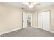 Large, bright bedroom features a ceiling fan and double-door closet for maximum space and comfort at 8750 Sw 108Th St, Ocala, FL 34481