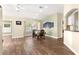 Well-lit dining room showcasing wood flooring and window with plantation shutters at 8750 Sw 108Th St, Ocala, FL 34481