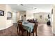 Light and airy dining room features wood floors and a view into the living room with modern ceiling fan at 8750 Sw 108Th St, Ocala, FL 34481