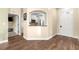 Hallway view to kitchen, showing stainless steel appliances and granite counter tops at 8750 Sw 108Th St, Ocala, FL 34481