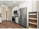 Updated kitchen boasts stainless-steel appliances, granite counters, and pull out shelves at 8750 Sw 108Th St, Ocala, FL 34481
