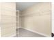 Spacious walk-in closet with wire shelving and carpet providing ample storage at 8750 Sw 108Th St, Ocala, FL 34481