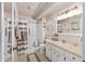 Functional bathroom featuring a shower with seat and safety bar at 8833 Sw 98Th Street Rd # E, Ocala, FL 34481