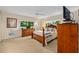Relaxing bedroom with large windows providing natural light and ceiling fan at 8833 Sw 98Th Street Rd # E, Ocala, FL 34481