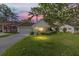 Charming home with well-maintained lawn during sunset at 8833 Sw 98Th Street Rd # E, Ocala, FL 34481