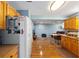 Open concept kitchen and living area with modern appliances and wood look vinyl flooring at 8833 Sw 98Th Street Rd # E, Ocala, FL 34481