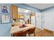 Bright kitchen with wood cabinets, white appliances, and casual dining area, perfect for meals at 8833 Sw 98Th Street Rd # E, Ocala, FL 34481