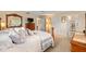 Spacious bedroom featuring a large bed and ensuite bathroom at 8833 Sw 98Th Street Rd # E, Ocala, FL 34481
