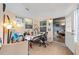 Bright office with neutral walls, tile flooring, and a white door leading to another room at 8833 Sw 98Th Street Rd # E, Ocala, FL 34481