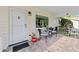 Inviting porch with brick-paved flooring and outdoor seating at 8833 Sw 98Th Street Rd # E, Ocala, FL 34481