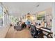 Bright sun room featuring tile flooring, comfortable seating, and plenty of natural light at 8833 Sw 98Th Street Rd # E, Ocala, FL 34481