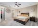 Comfortable bedroom featuring a ceiling fan, neutral walls, and carpet flooring at 8878 Sw 103Rd Cir, Ocala, FL 34481