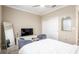 Cozy bedroom featuring a large window, closet space, and comfortable seating at 8878 Sw 103Rd Cir, Ocala, FL 34481