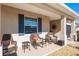 Welcoming front porch with cozy seating, offering a relaxing outdoor space to enjoy the neighborhood views at 8878 Sw 103Rd Cir, Ocala, FL 34481