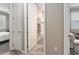 Hallway leading to bedroom and bath featuring tile flooring and neutral paint at 8878 Sw 103Rd Cir, Ocala, FL 34481