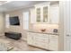 Kitchen area features white cabinets, granite countertops and a matching backsplash with decor at 8878 Sw 103Rd Cir, Ocala, FL 34481