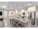 Modern kitchen with stainless steel appliances, granite countertops, and a large center island at 8878 Sw 103Rd Cir, Ocala, FL 34481