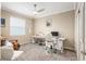 Well-lit office space with carpet, a ceiling fan, and a bright window at 8878 Sw 103Rd Cir, Ocala, FL 34481