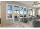 Inviting covered patio with comfortable seating and views of the spa at 8878 Sw 103Rd Cir, Ocala, FL 34481