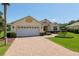 Charming single-story home featuring a brick driveway, well-maintained landscaping, and a convenient two-car garage at 8904 Sw 84Th Cir, Ocala, FL 34481