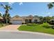 Inviting single-story home with a brick driveway, well-manicured landscaping, and a convenient two-car garage at 8904 Sw 84Th Cir, Ocala, FL 34481