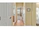 View down a bright hallway towards the front door and living spaces at 8904 Sw 84Th Cir, Ocala, FL 34481