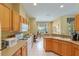 Full kitchen view with a breakfast bar, sink, and built in appliances at 8904 Sw 84Th Cir, Ocala, FL 34481