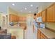 Bright kitchen features wooden cabinets, modern appliances, and a functional layout for easy cooking at 8904 Sw 84Th Cir, Ocala, FL 34481
