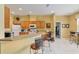 Open kitchen features a breakfast bar, plenty of cabinets, and access to adjacent rooms at 8904 Sw 84Th Cir, Ocala, FL 34481