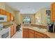 Eat-in kitchen featuring a breakfast bar, modern sink, and well-lit space for dining at 8904 Sw 84Th Cir, Ocala, FL 34481