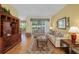 Spacious living room features hardwood floors, comfortable seating, and lots of natural light at 8904 Sw 84Th Cir, Ocala, FL 34481
