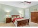 Inviting bedroom featuring neutral carpet, ample natural light and a ceiling fan at 8904 Sw 84Th Cir, Ocala, FL 34481