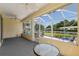 Covered patio featuring ceiling fans and patio furniture, perfect for outdoor gatherings at 8904 Sw 84Th Cir, Ocala, FL 34481