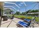Spacious screened patio with comfortable outdoor seating and a view of the lush backyard at 8904 Sw 84Th Cir, Ocala, FL 34481