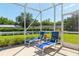 Screened patio with chaise lounges, perfect for enjoying the outdoors in comfort at 8904 Sw 84Th Cir, Ocala, FL 34481