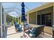Relaxing screened patio with ample seating, perfect for enjoying the outdoors in comfort and style at 8904 Sw 84Th Cir, Ocala, FL 34481