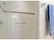 Bright white tiled shower with built in bench and metal fixtures at 8904 Sw 84Th Cir, Ocala, FL 34481