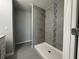 Contemporary bathroom features tiled walls, a modern shower, and new fixtures at 930 Nw 124Th Pl, Citra, FL 32113