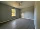 Bedroom featuring tiled floor, neutral paint, a ceiling fan, and window at 930 Nw 124Th Pl, Citra, FL 32113