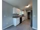 Stylish kitchen with stainless steel appliances, granite counters, and sleek tile flooring at 930 Nw 124Th Pl, Citra, FL 32113