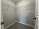 Walk-in closet features tiled flooring and functional wire shelving for storage and organization at 930 Nw 124Th Pl, Citra, FL 32113