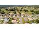 Aerial view of houses backing onto a golf course in a scenic neighborhood at 9347 Se 137Th Street Rd, Summerfield, FL 34491