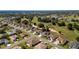 Scenic aerial view of golf course homes in a well-maintained suburban neighborhood at 9347 Se 137Th Street Rd, Summerfield, FL 34491
