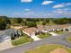 Aerial view of homes in a residential neighborhood near a golf course at 9347 Se 137Th Street Rd, Summerfield, FL 34491