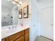 Bathroom featuring a modern sink, mirror and a doorway to the toilet room at 9347 Se 137Th Street Rd, Summerfield, FL 34491